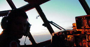 Aircraft commander sits in left seat